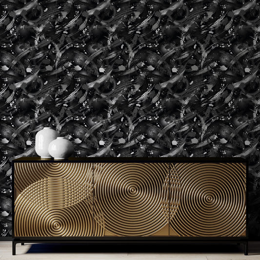a black and gold cabinet with a unique, swirling design on its surface. The cabinet is placed against a black and white abstract wallpaper pattern. There are two white vases on top of the cabinet, adding a touch of elegance to the overall design.