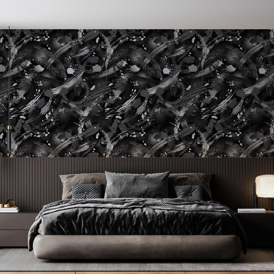 a modern bedroom with a large bed, dark bedding, and a black and white abstract wallpaper pattern on the wall behind it.