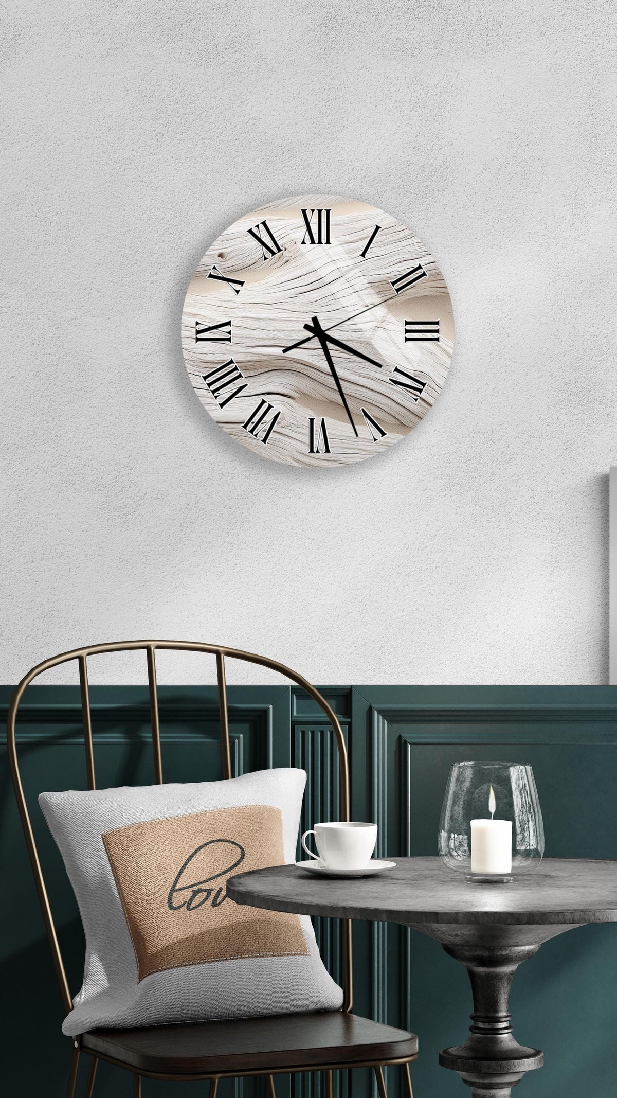 a modern interior design with a round wall clock, a black metal chair, a white table with a candle, and a beige pillow with the word "love" on it.