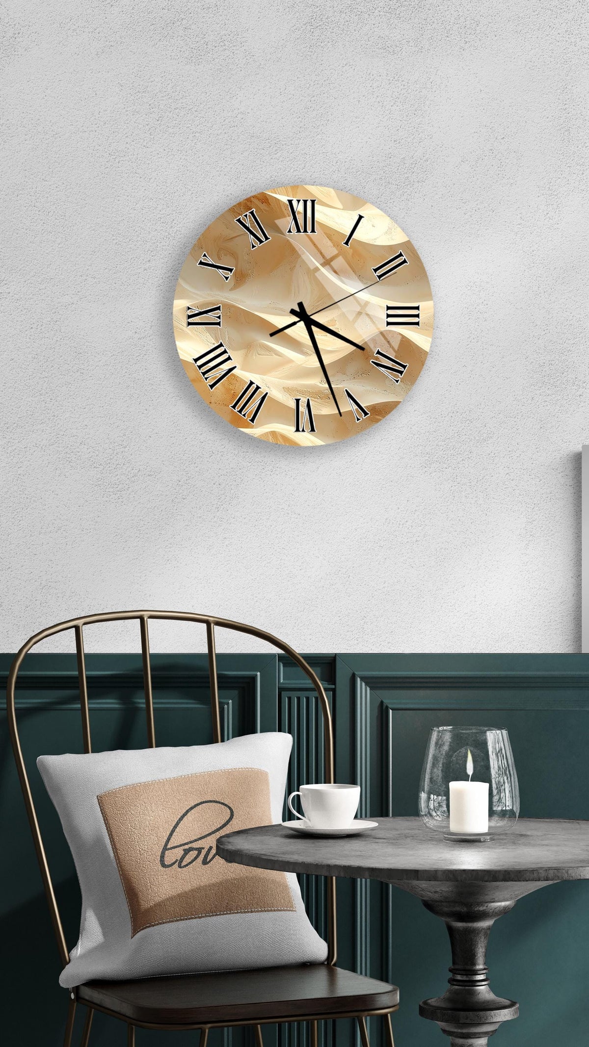 a wall clock with a gold-colored face, a white table with a candle and a glass, and a chair with a pillow on it.