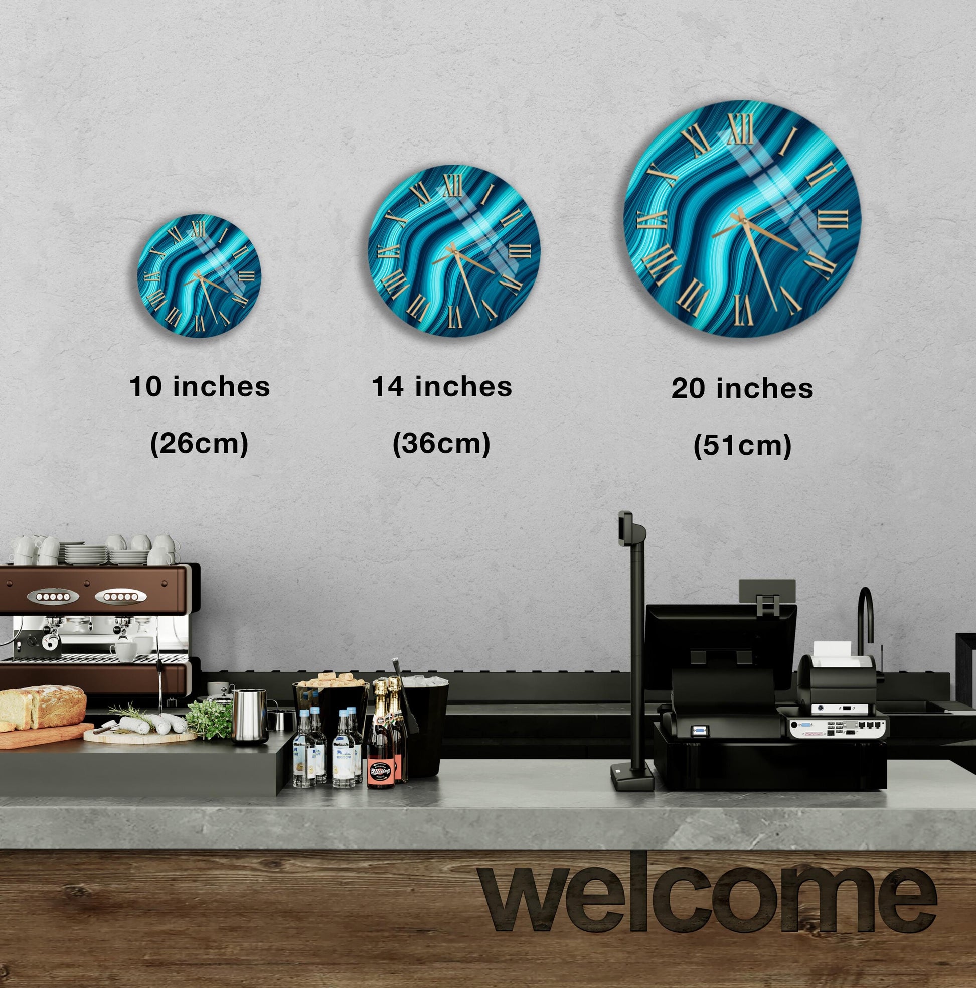 a wall with three clock designs of different sizes, ranging from 10 inches to 20 inches in diameter. Below the clocks, there is a counter with various items such as bottles and a cash register. The word "welcome" is also visible in the image.