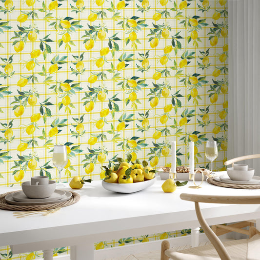 a dining table set with various items, including a bowl of fruit, wine glasses, and plates. The table is surrounded by chairs, and the wall behind it has a vibrant yellow and green patterned wallpaper.