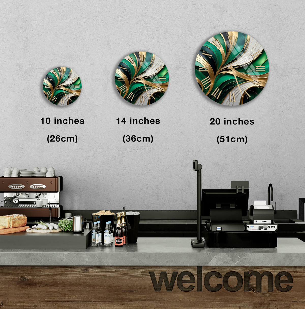 a counter with a cash register, a coffee machine, and a welcome sign. There are three clock-like designs displayed on the wall, each representing a different size of the same design.