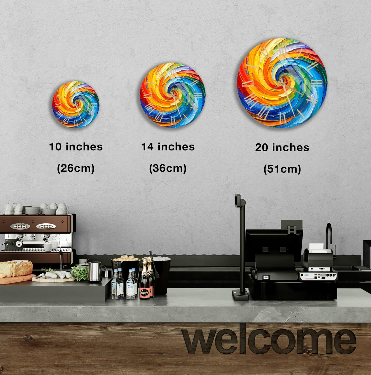 a counter in a restaurant with a welcome sign, and there are three different sizes of colorful spiral designs displayed on the wall above the counter.