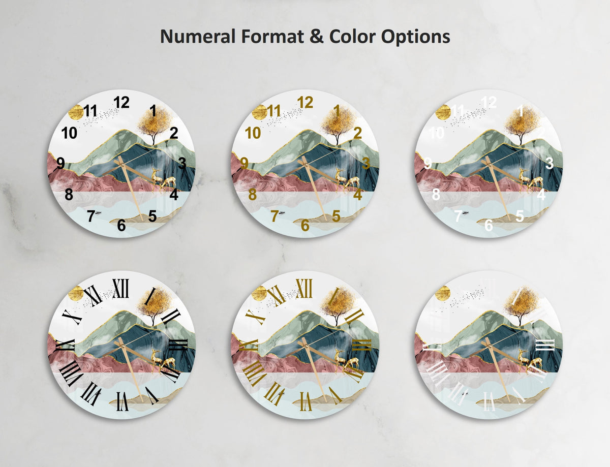 a set of four clocks with a mountain scene on them