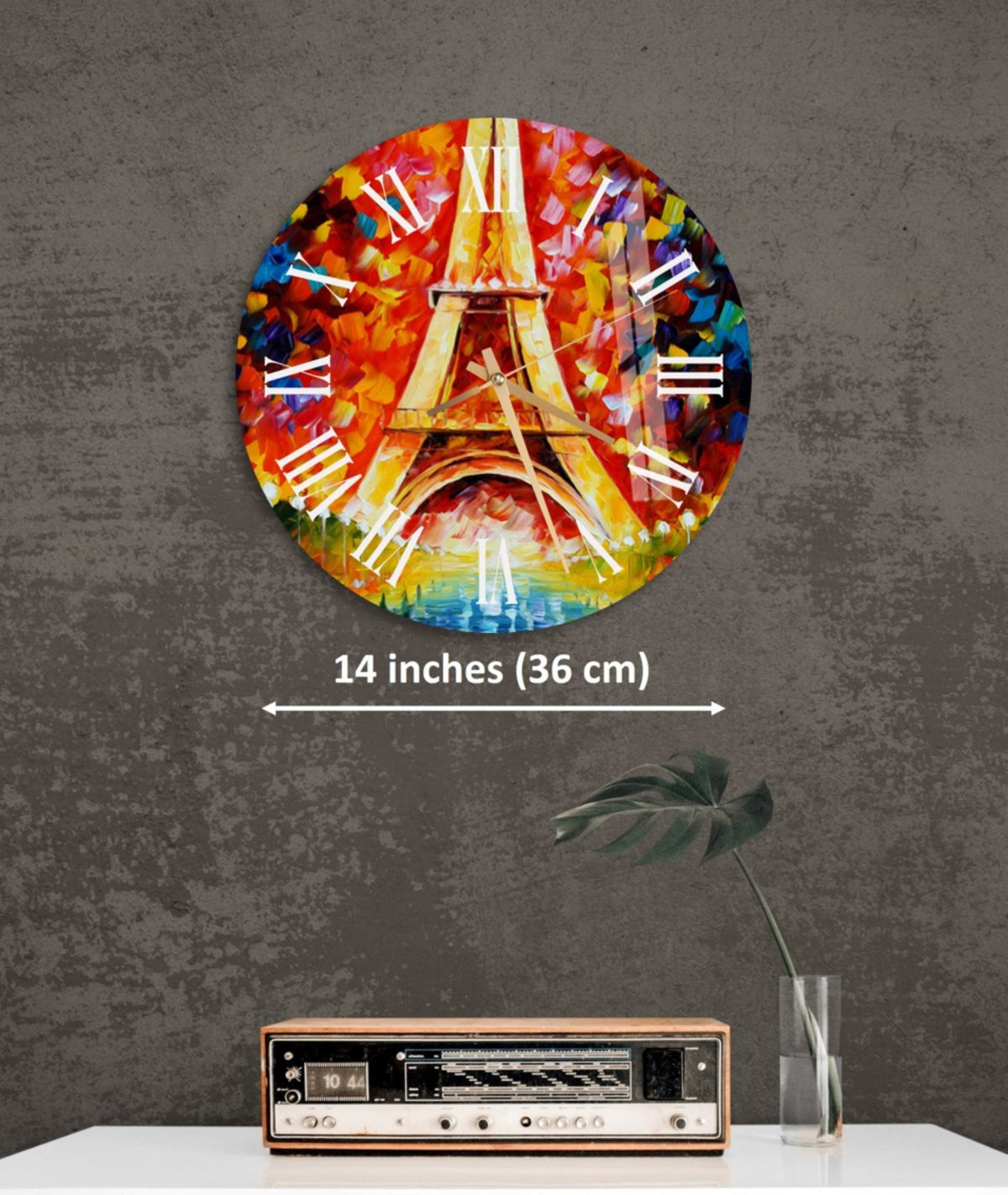 a clock with a painting of the eiffel tower