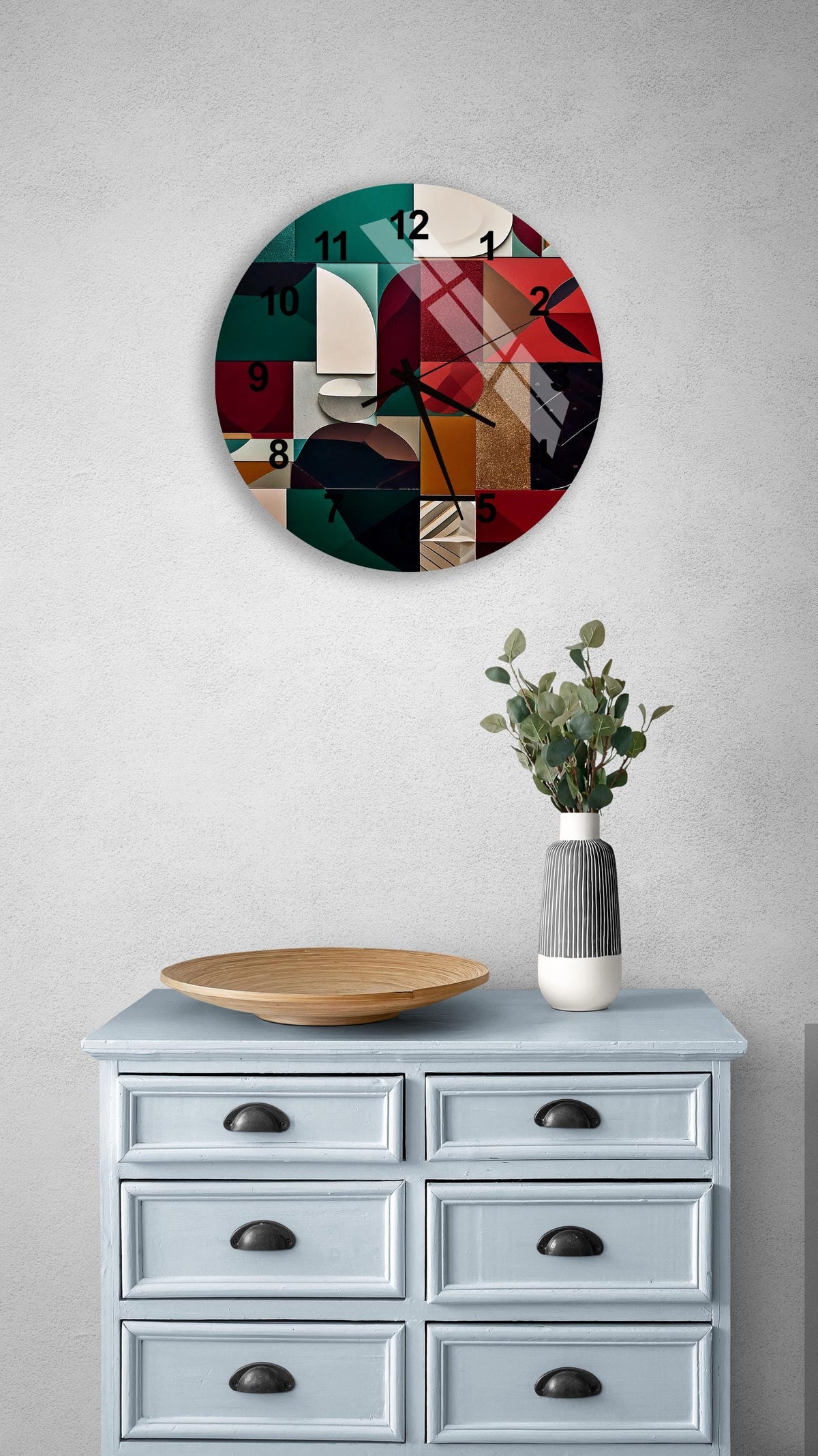 a clock on a wall above a dresser