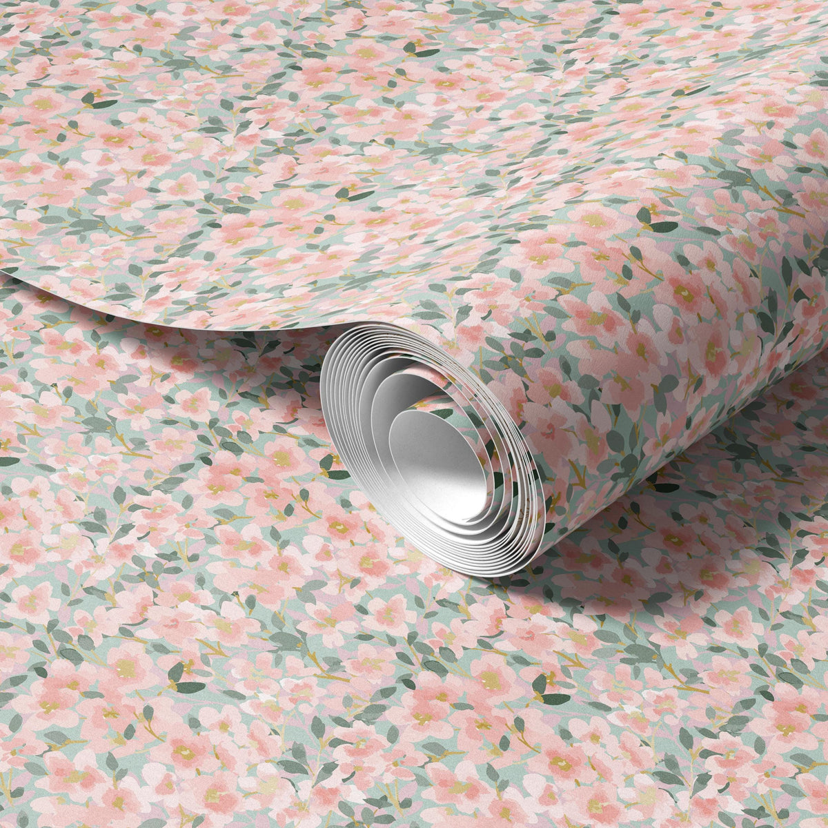 a roll of paper with a floral pattern of pink and green flowers on it.