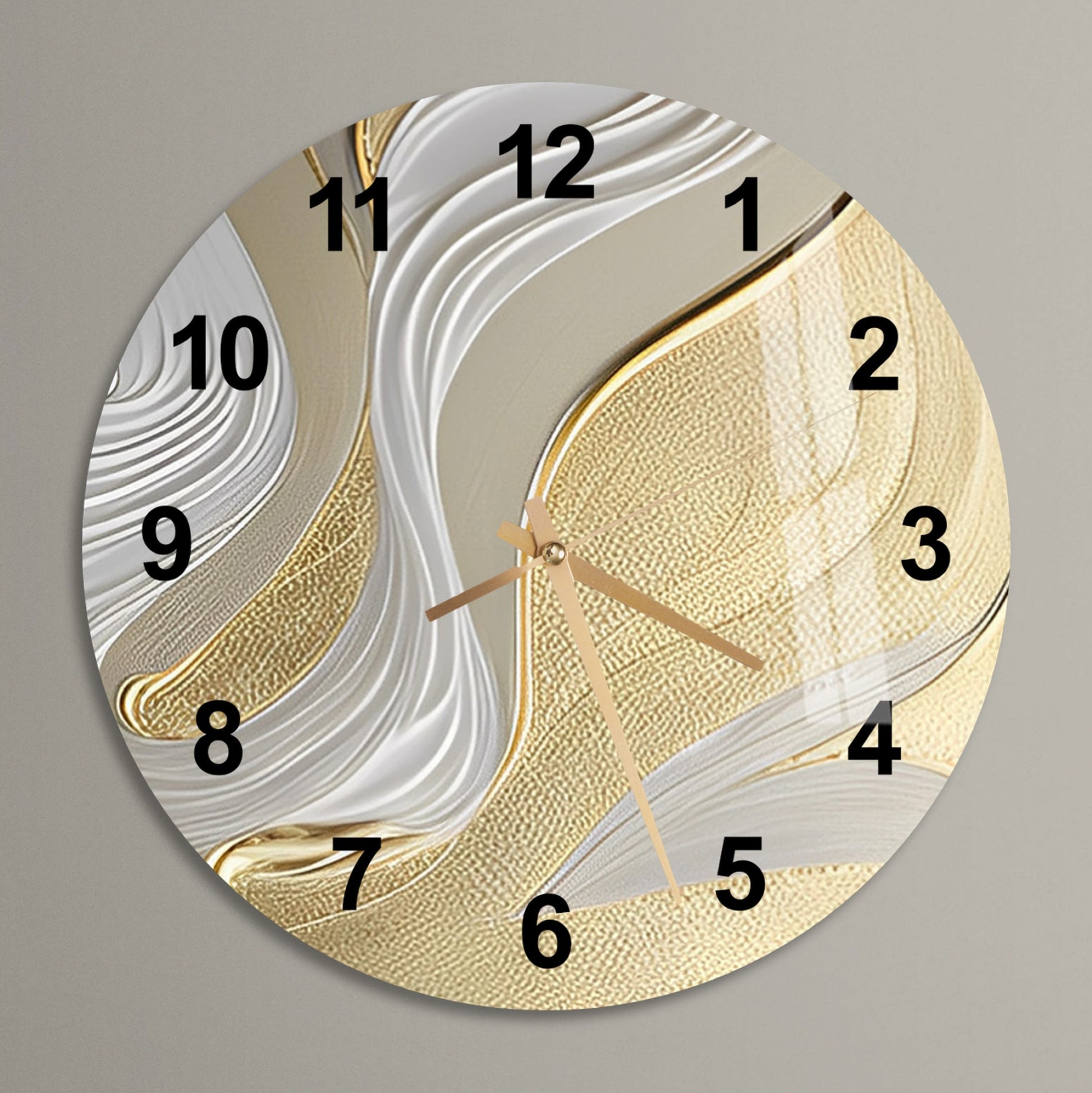 a gold and white clock with numbers on it