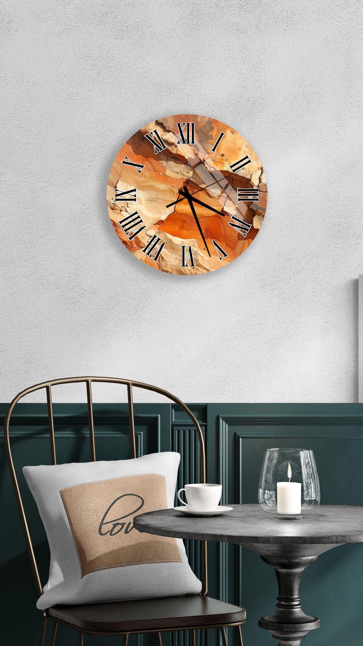 a round wall clock with an abstract design, mounted on a wall above a table with a white tablecloth.