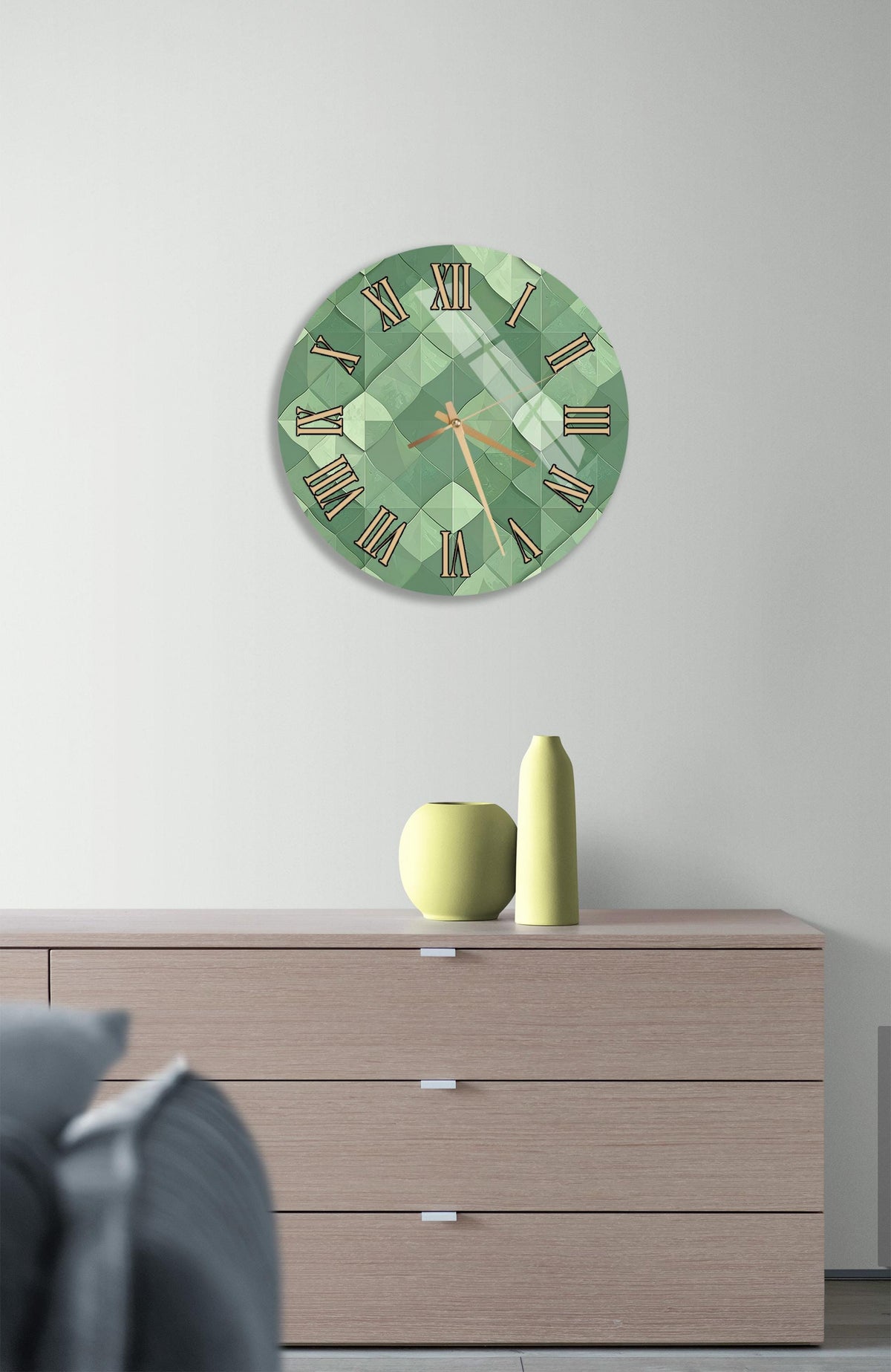 a modern living room with a green clock on the wall above a wooden dresser. The dresser has three drawers and a vase on top.