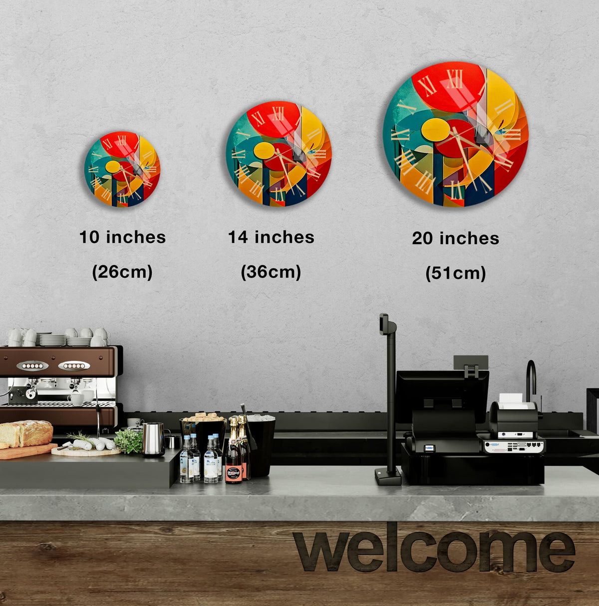 a kitchen counter with three clocks on the wall