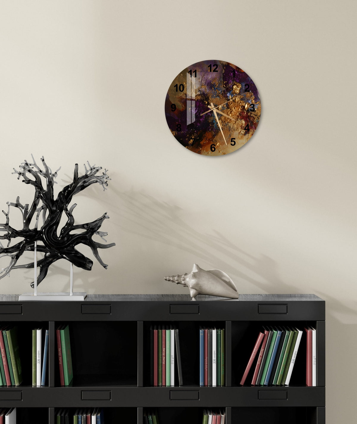 a clock on a wall above a bookcase