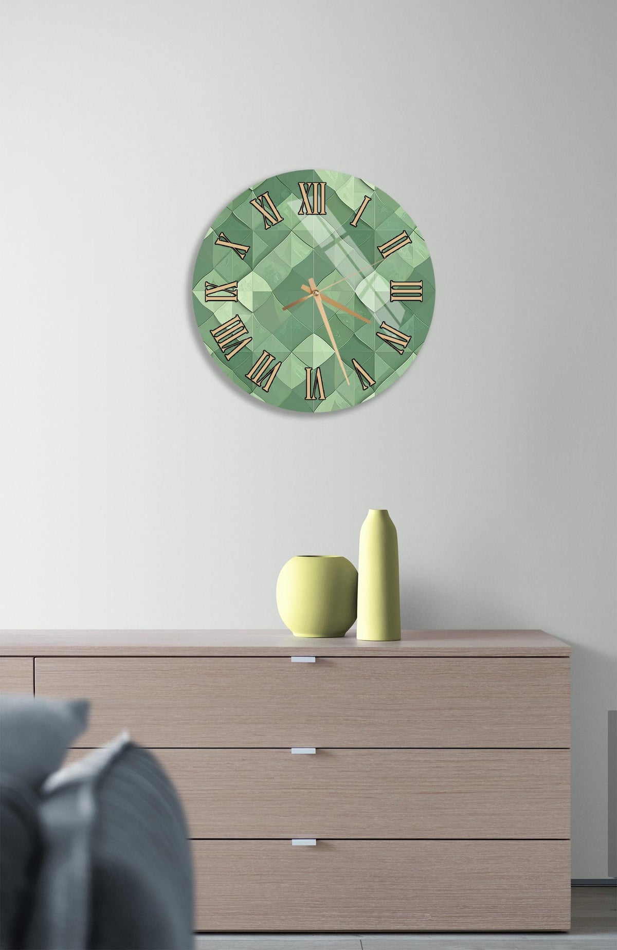 a modern living room with a green clock on the wall above a wooden dresser. The dresser has three drawers and a vase on top.