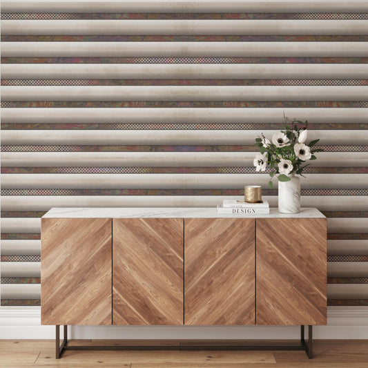 a wooden cabinet with a white marble top, set against a striped wall. The cabinet has three doors and a shelf, and there is a vase of flowers on top of it.