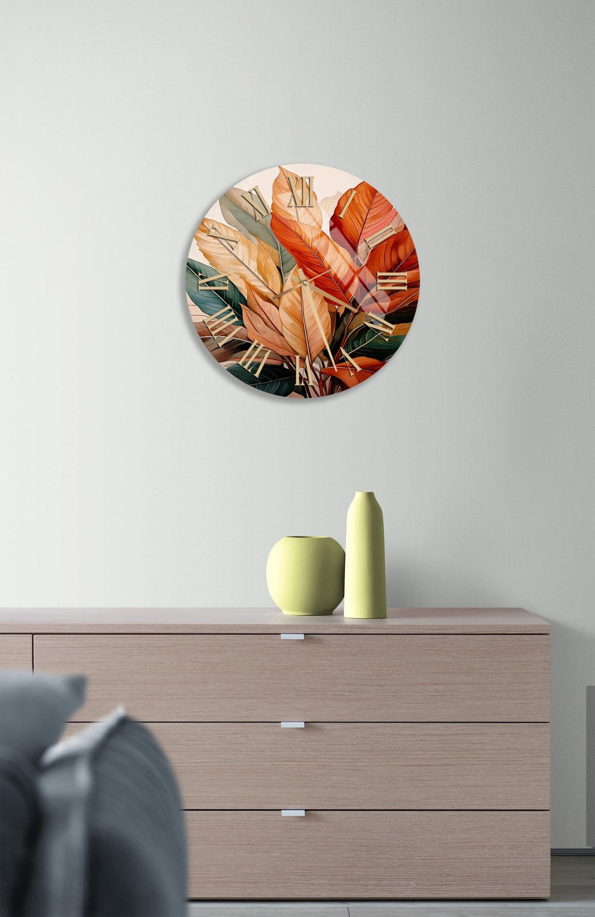 a wall clock with a painting of oranges on it