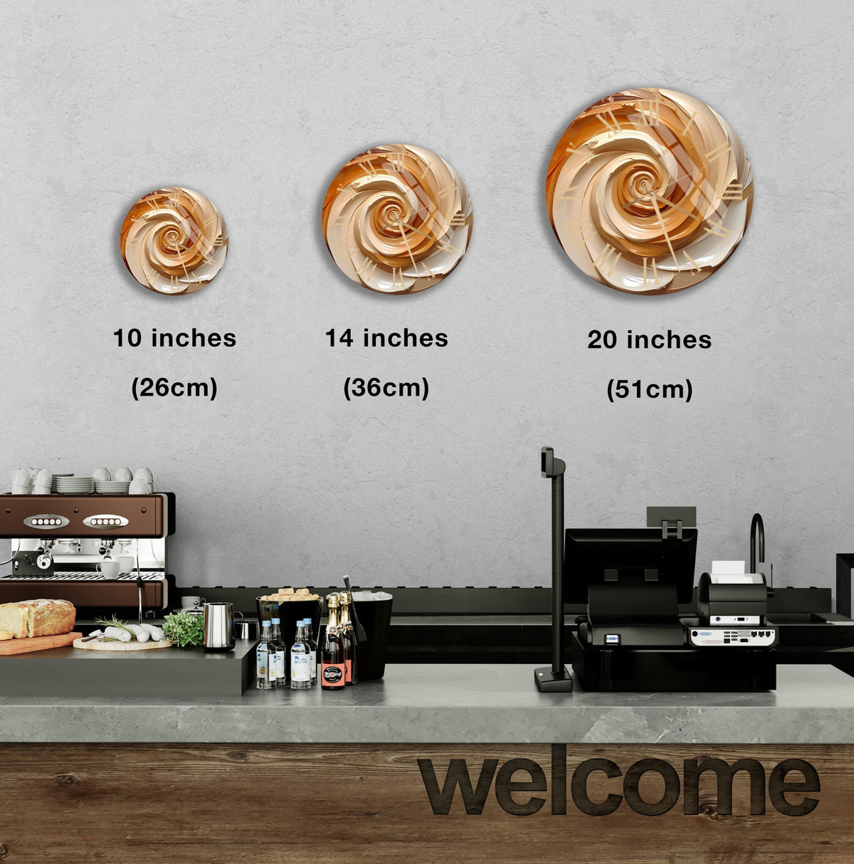a counter in a restaurant with three different sizes of spiral designs on the wall above it, and a welcome sign below the counter.