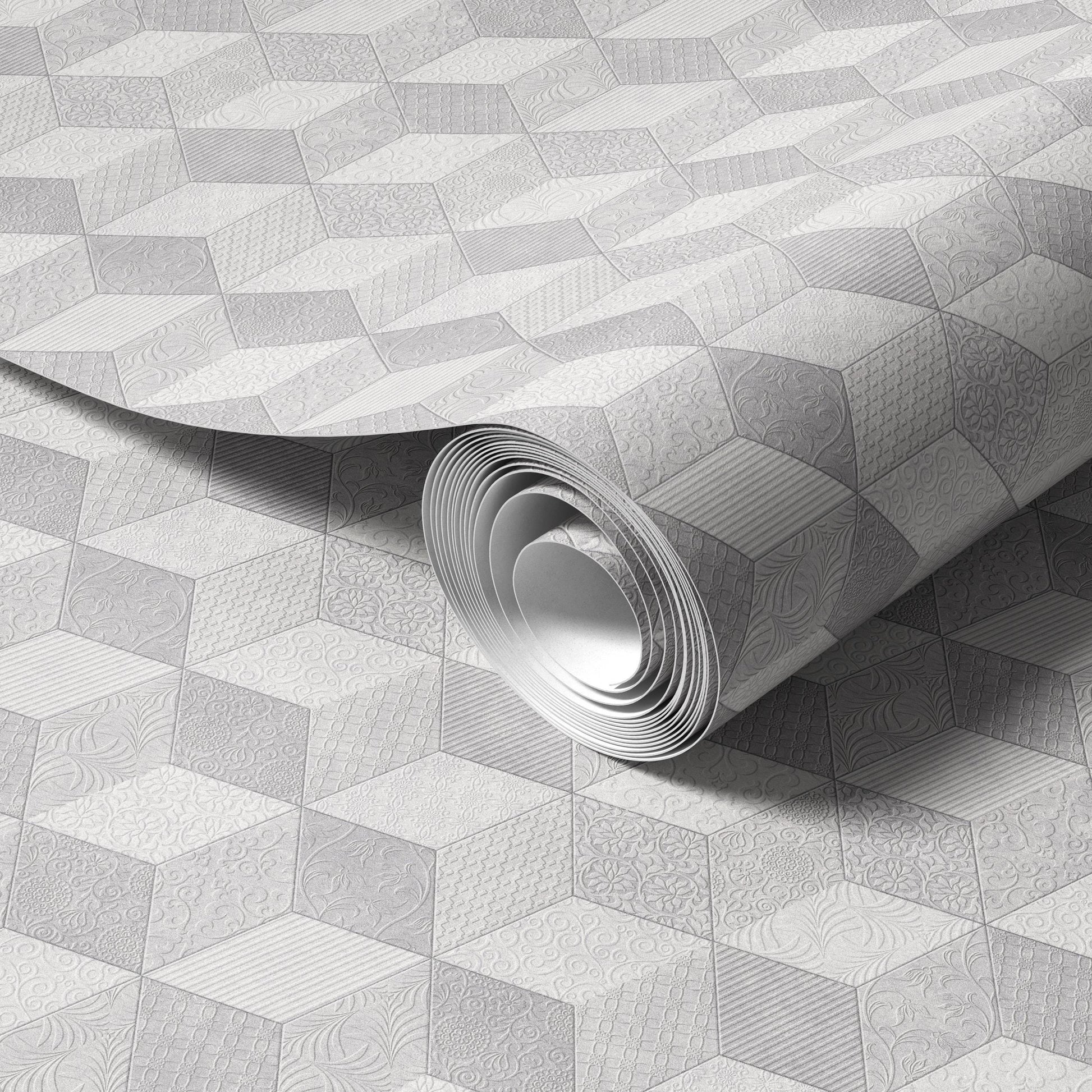A roll of patterned wallpaper with a geometric design, featuring a repeating pattern of hexagons and diamonds in shades of gray and white.
