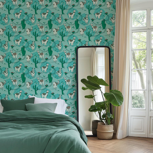a bedroom with a large mirror, a bed with a green blanket, and a potted plant. The walls are covered in a vibrant, repeating pattern of cacti and other desert-themed illustrations in shades of green and blue.