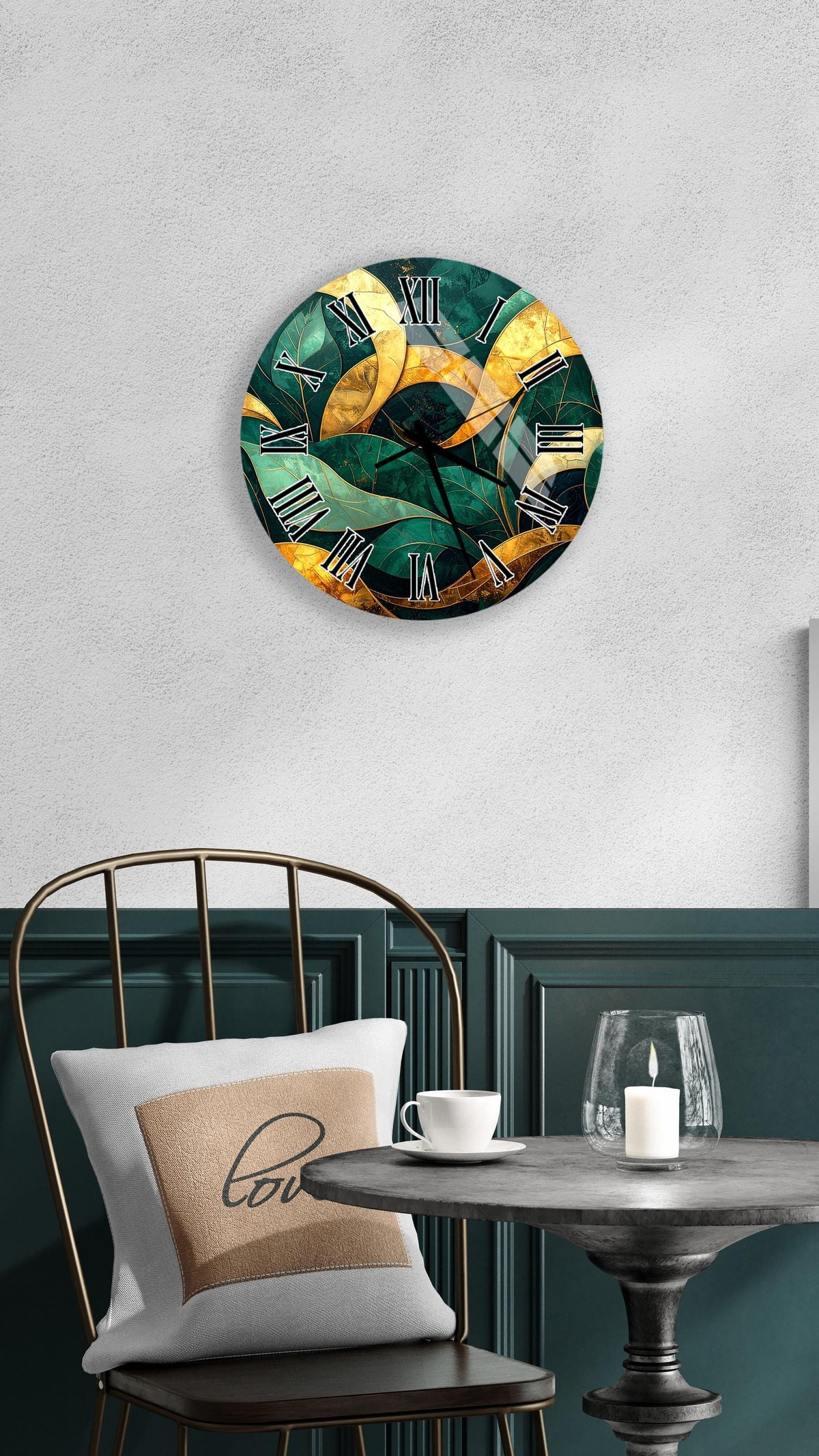 a modern, abstract clock with a green and gold color scheme, mounted on a wall above a table with a white tablecloth. The table is set with a white cup and a candle, creating a cozy and inviting atmosphere.