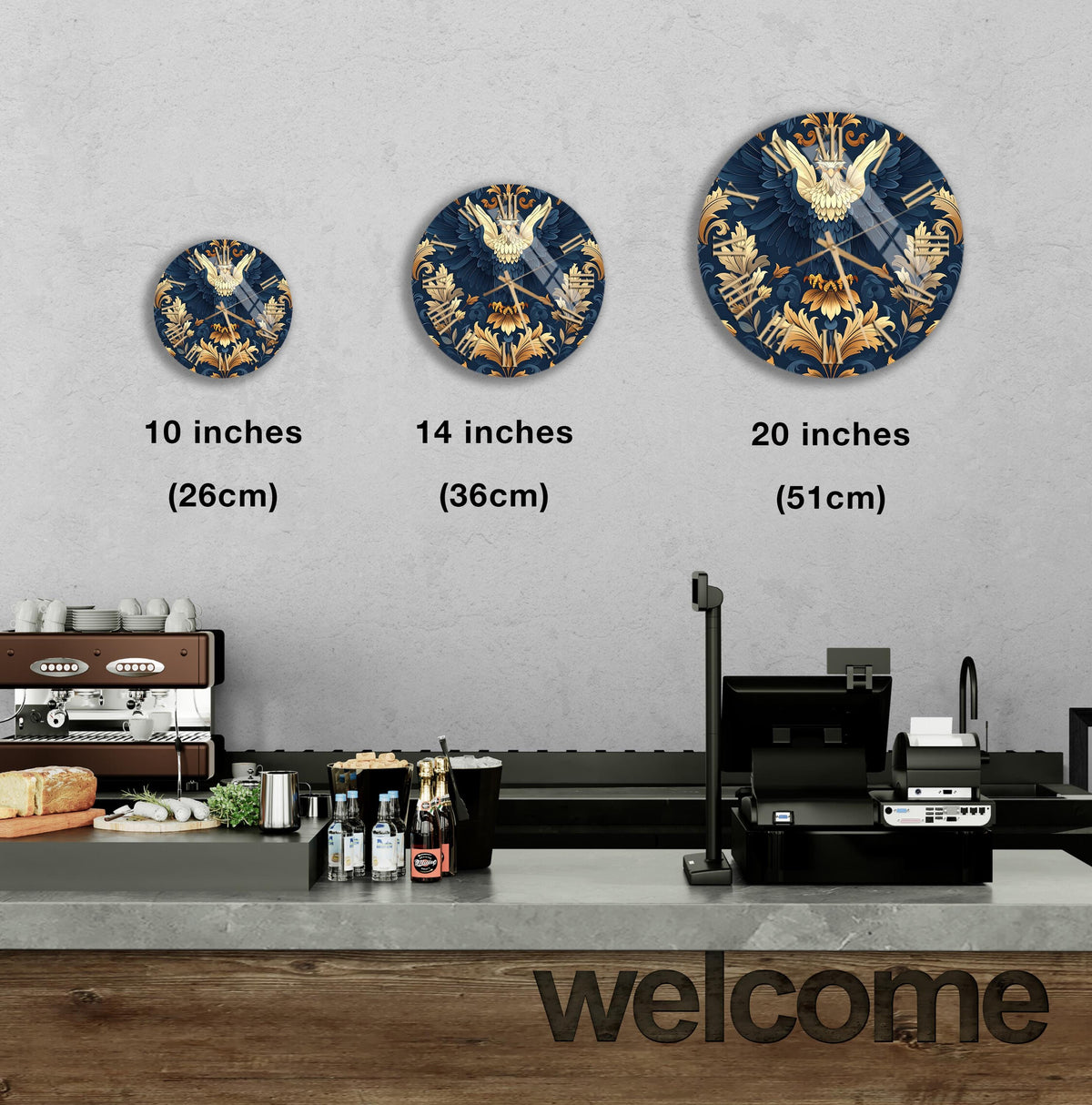a wall with three clock designs of different sizes, each with a unique design and color scheme. The wall also displays a welcome sign and a counter with various items, such as bottles and a sandwich.