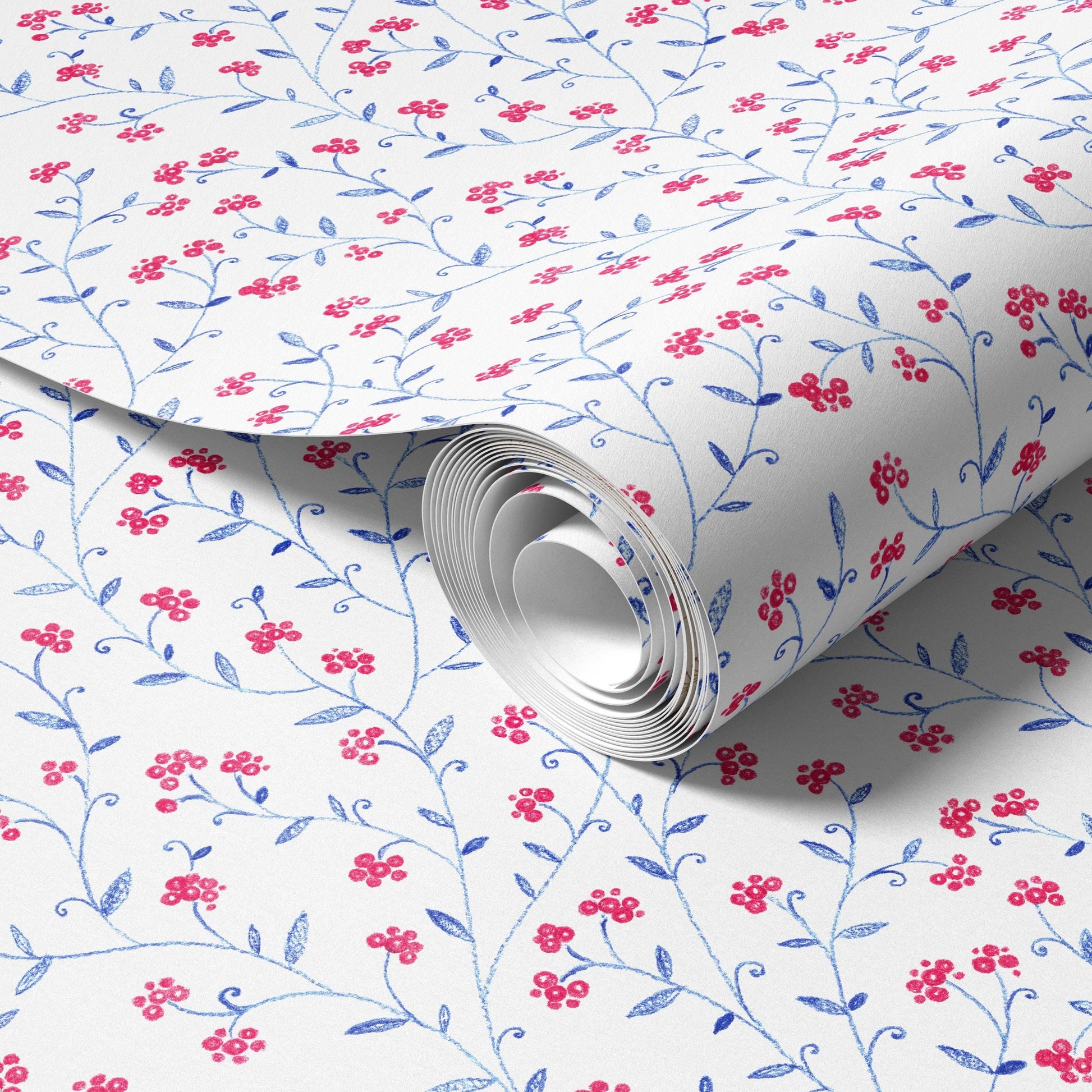 a roll of wallpaper with a floral pattern in shades of red and blue.