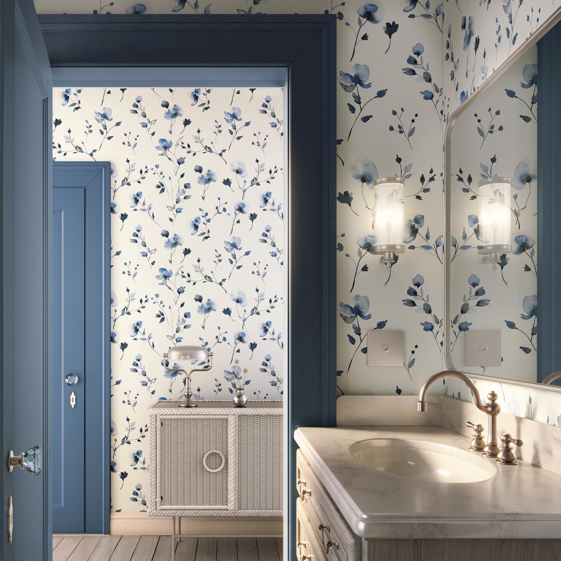 a bathroom with a blue and white floral wallpaper, a white vanity with a sink, and a mirror above the vanity.