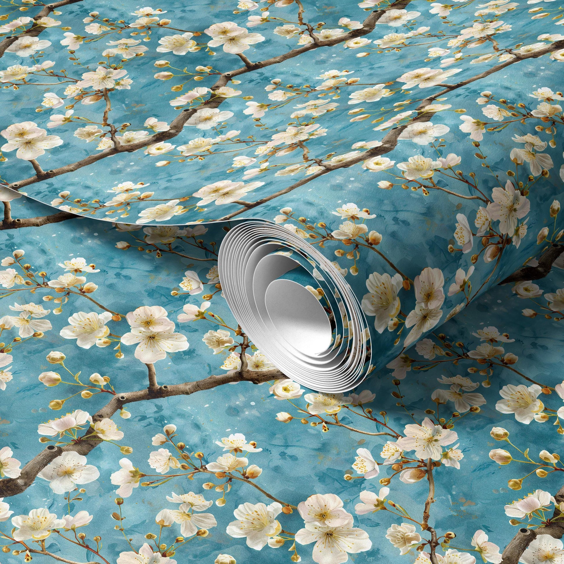 a roll of wallpaper with a floral pattern of white flowers and branches against a blue background.