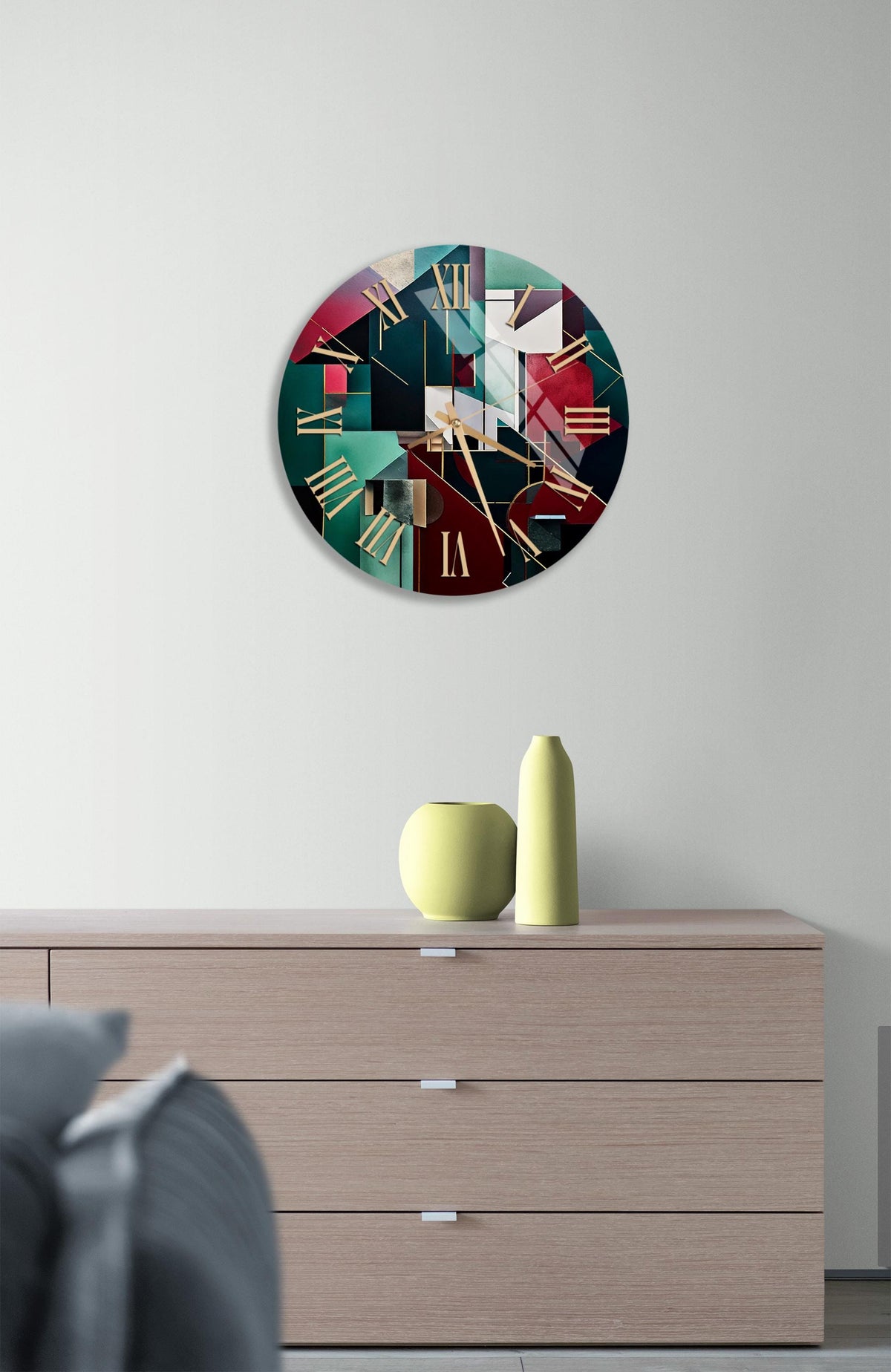 a clock on a wall above a dresser