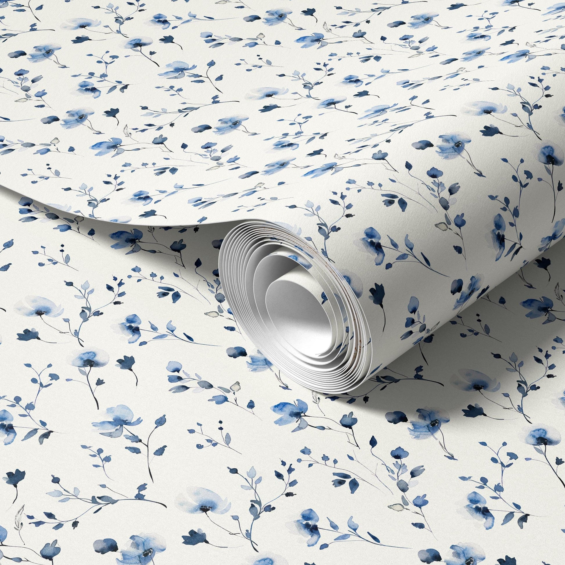 a roll of wallpaper with a blue floral pattern.