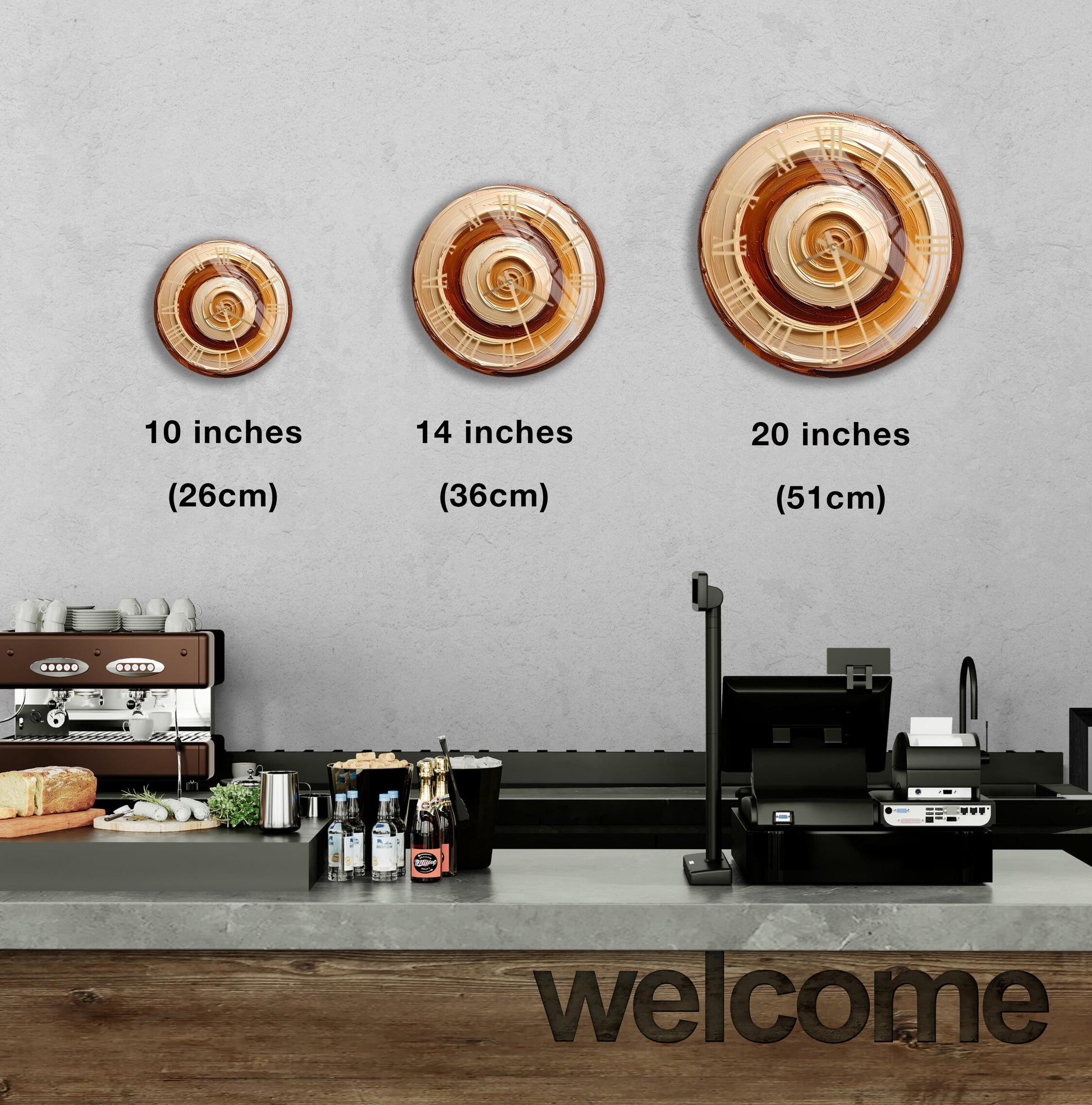 a counter in a restaurant with a coffee machine, a cash register, and a welcome sign. There are three different sizes of a circular clock displayed on the wall above the counter.