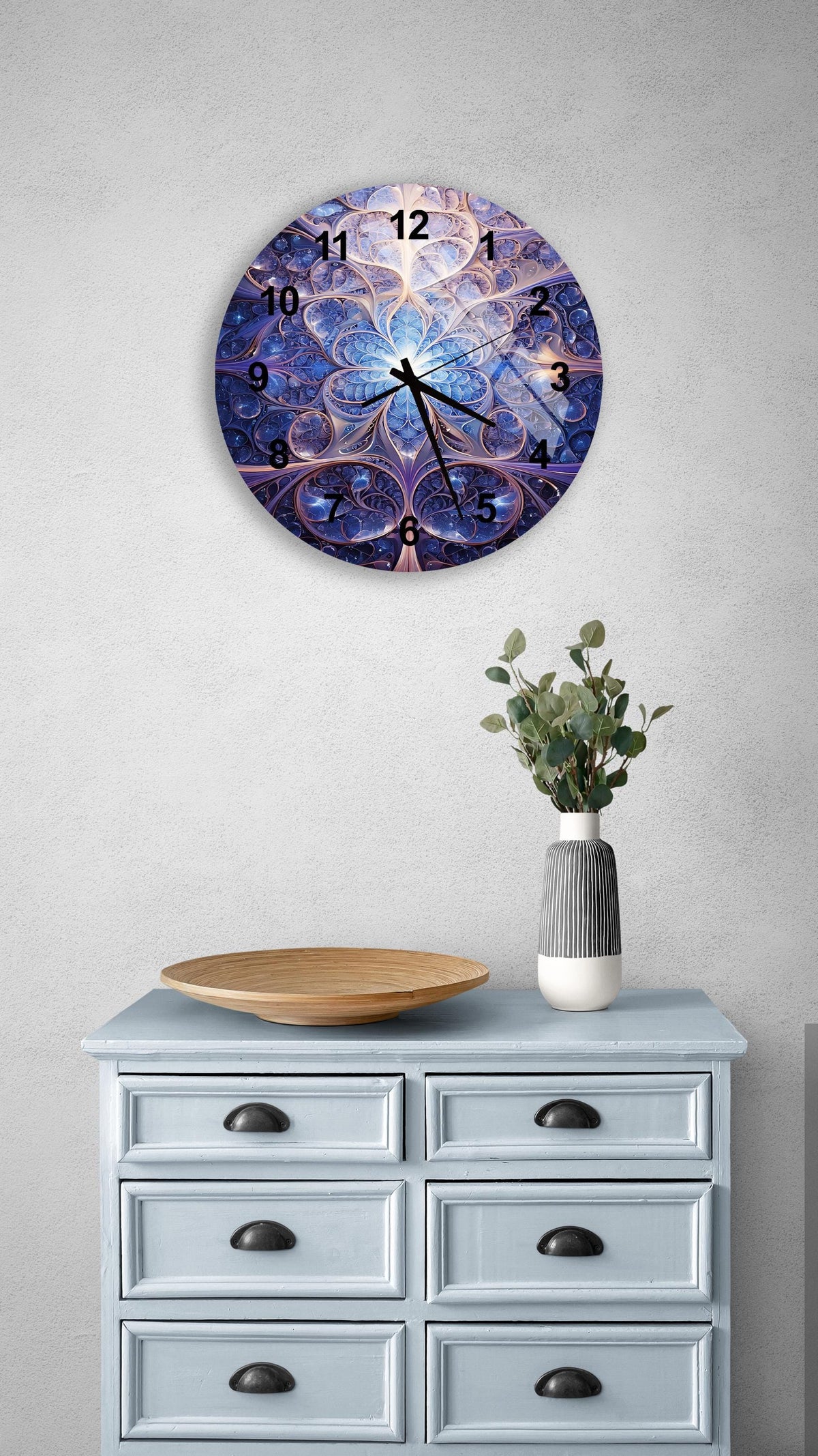 a clock on a wall above a dresser