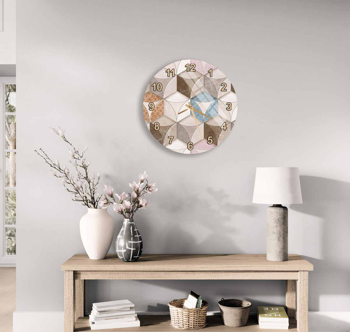a modern and minimalist living room with a wooden console table, a round wall clock, and various decorative elements such as a vase with flowers, a lamp, and a stack of books.