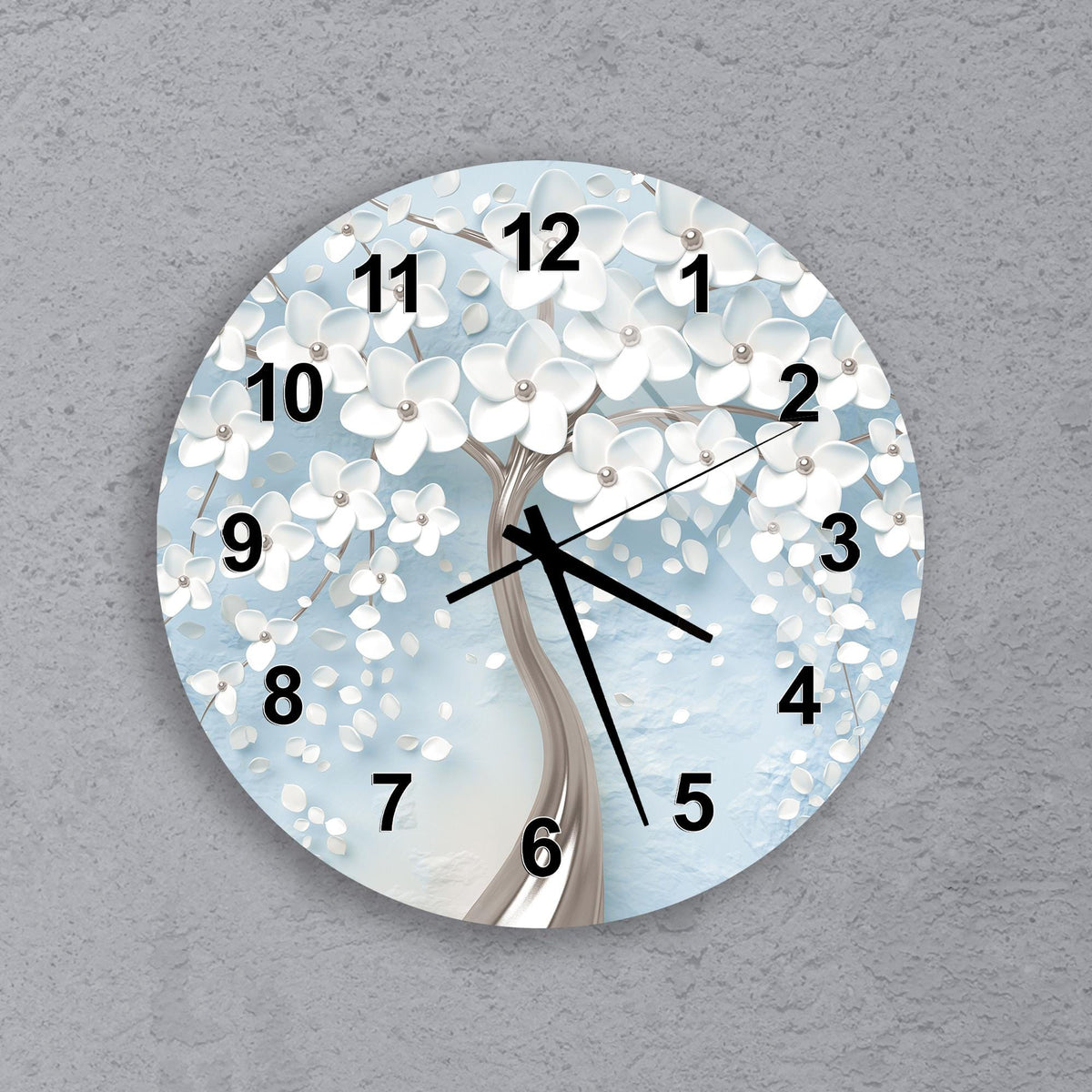 A wall clock with a white tree design on a blue background.