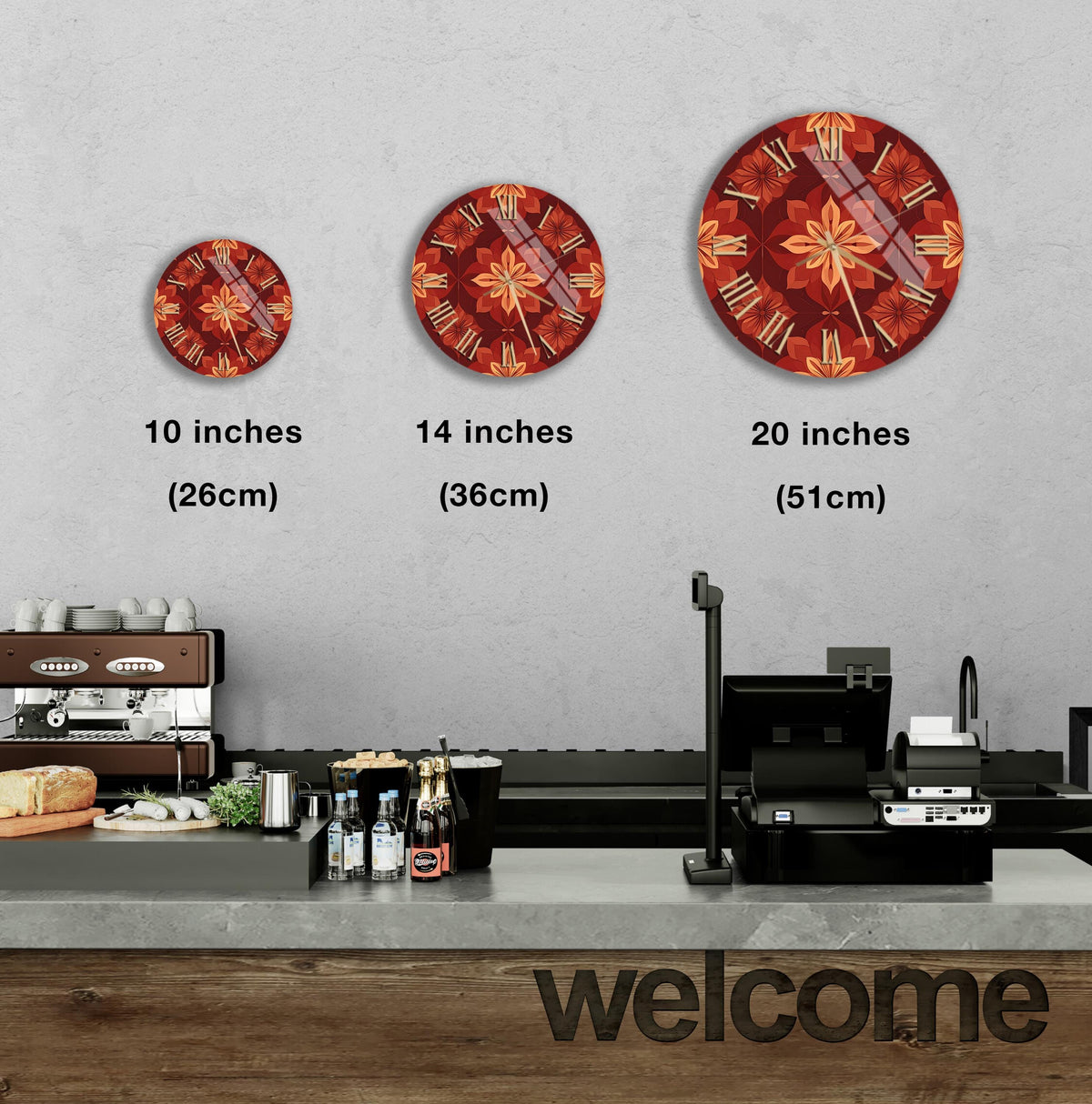 a wall with three clock designs of different sizes, ranging from 10 inches to 20 inches in diameter. Below the clocks, there is a counter with various items such as bottles and a cash register. The word "welcome" is also visible in the image.