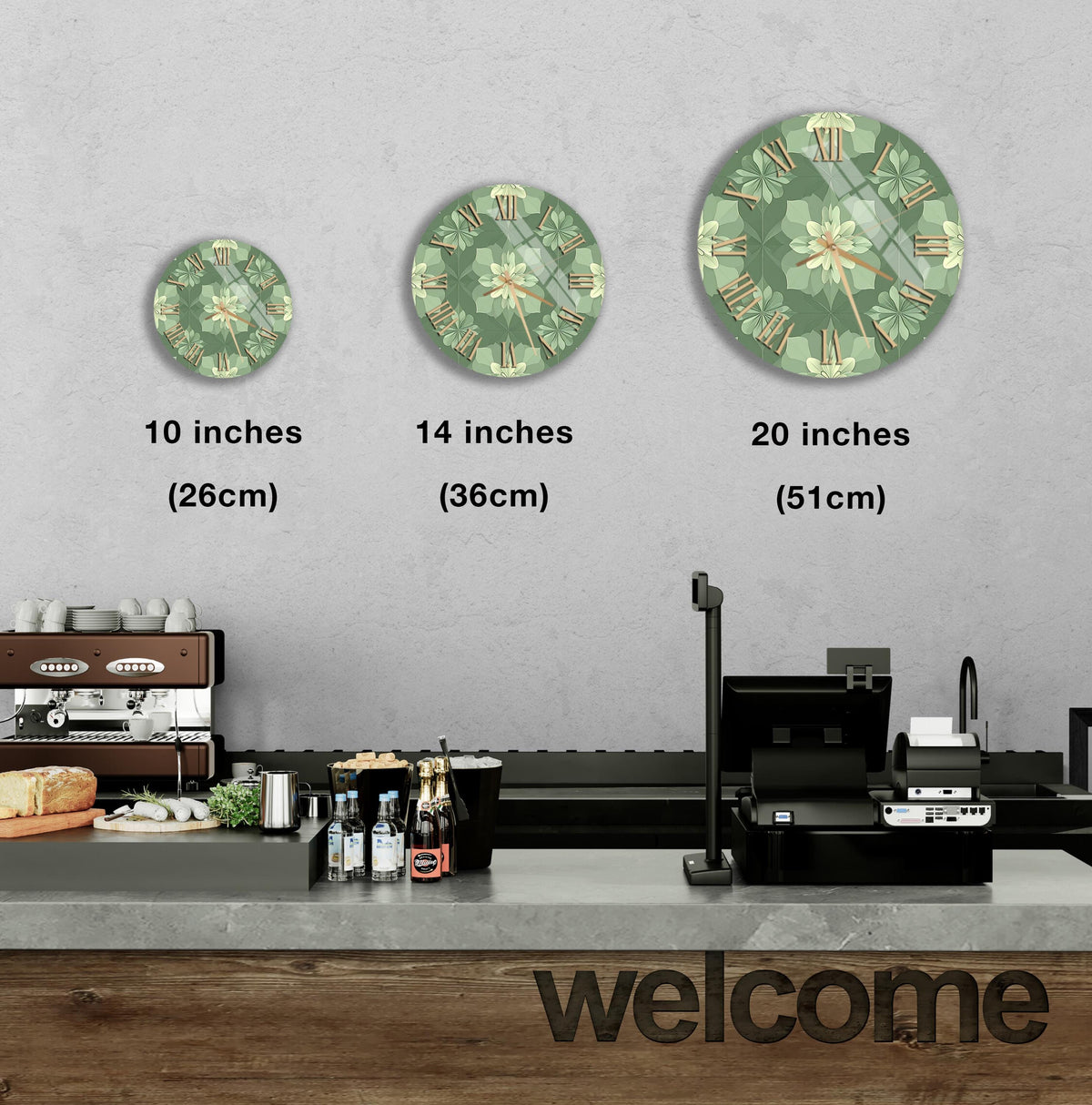 a counter with a cash register, a coffee machine, and a welcome sign. There are three clock faces of different sizes displayed on the wall above the counter.