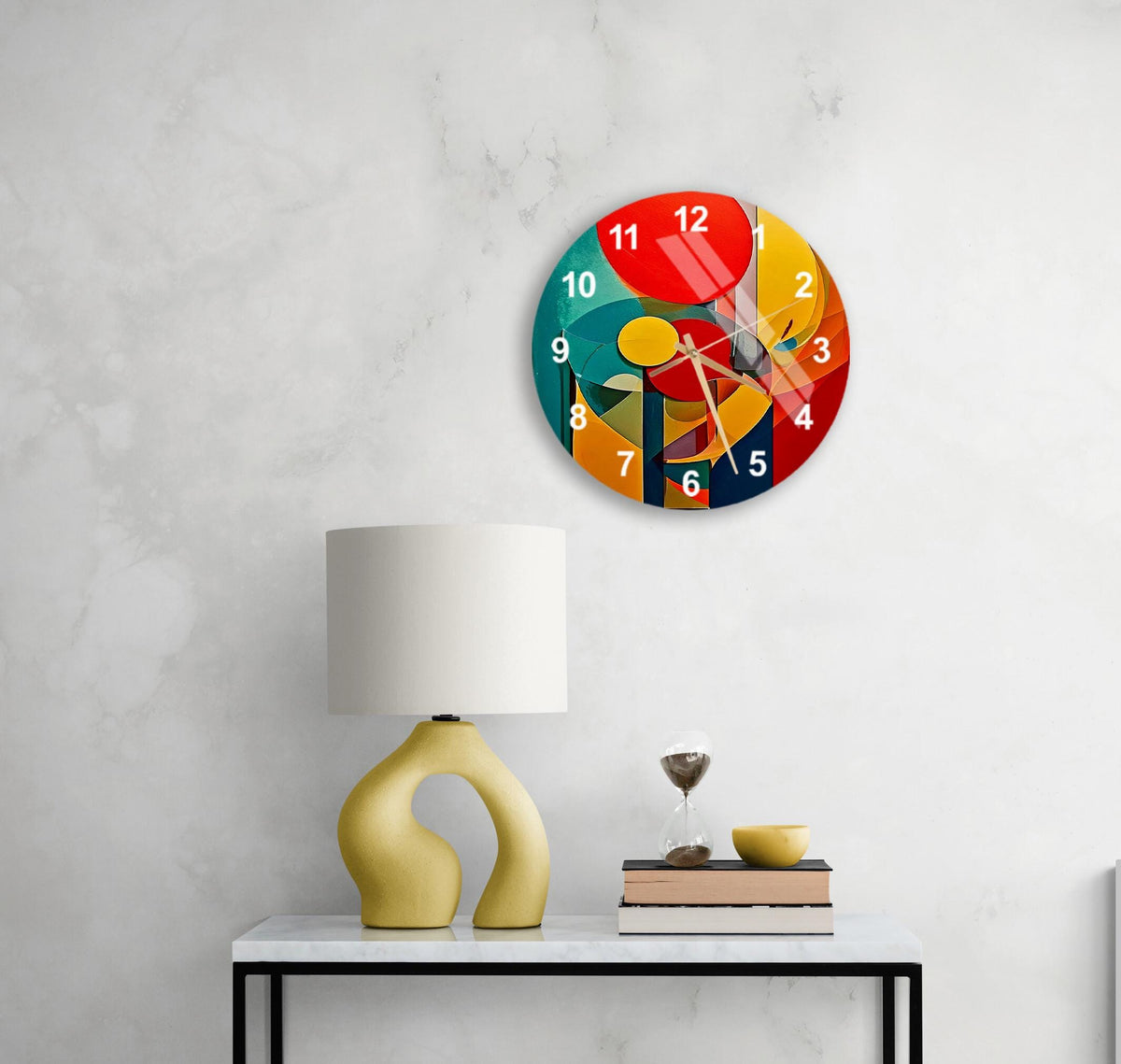 a colorful clock on a white wall above a table