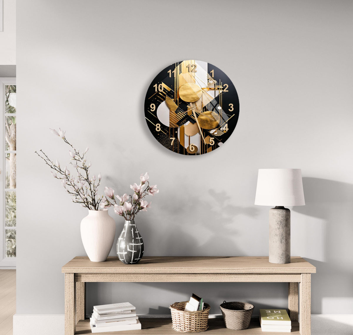 a clock on the wall above a table with a vase of flowers
