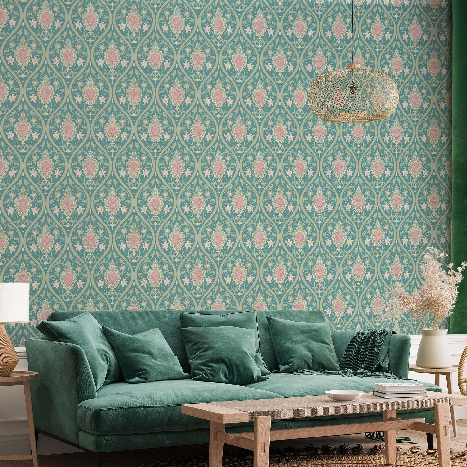 a living room with a green velvet sofa, a wooden coffee table, and a decorative wallpapered wall with a repeating pattern of pink and green flowers.