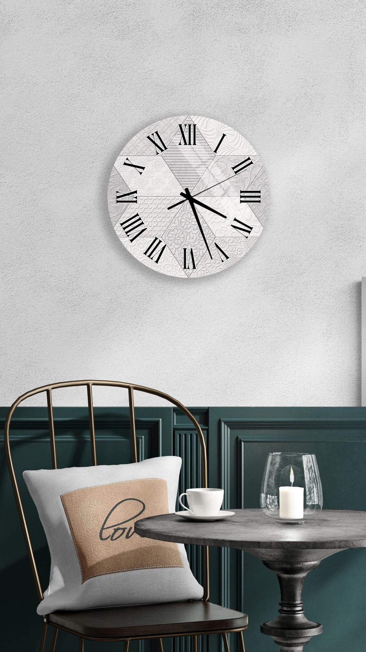 a modern interior design with a round wall clock, a black metal chair, a white table, and a beige pillow with the word "love" on it.