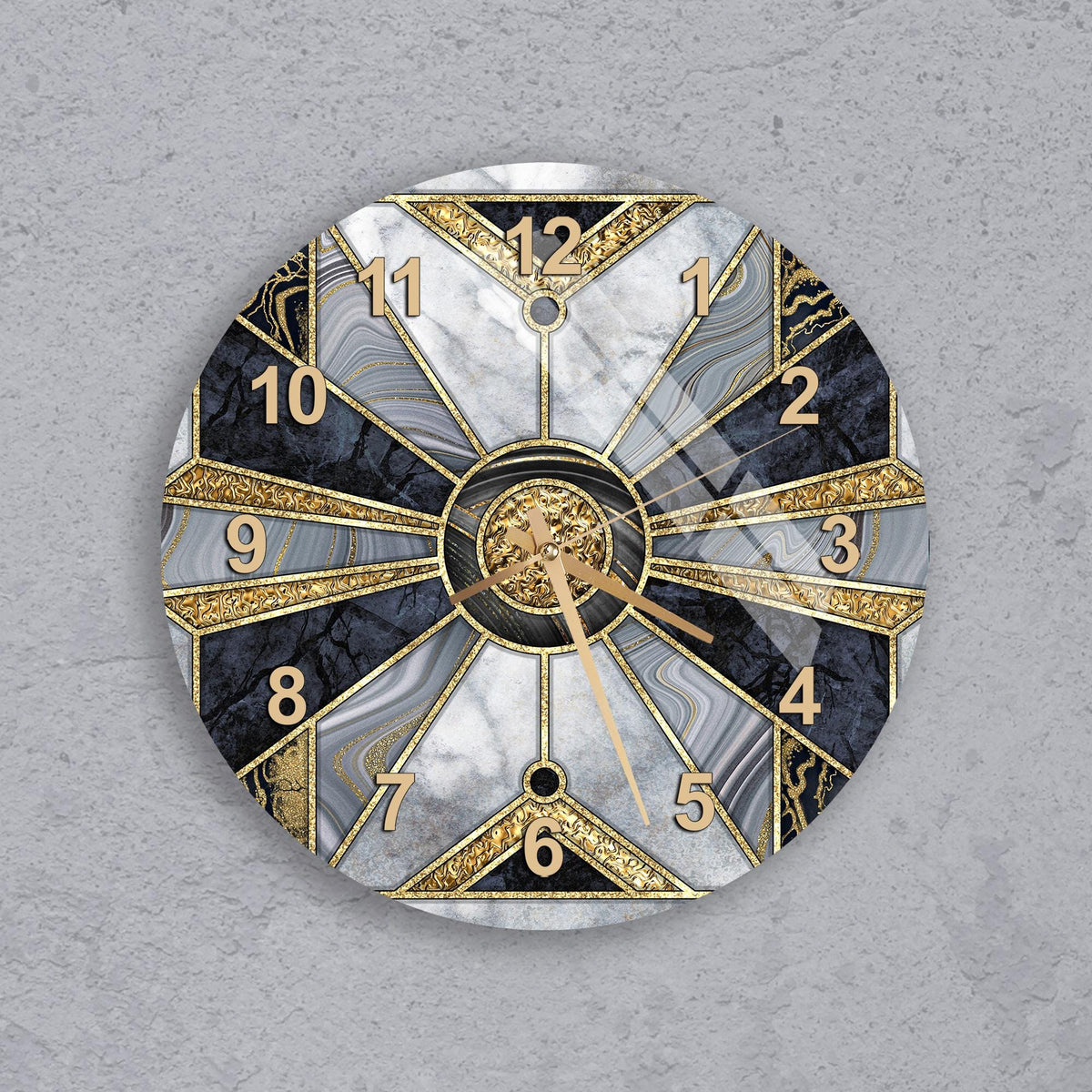 A wall clock with a gold and black marble design, featuring a central clock face with gold hands and numbers, and a dark background with a light gray texture.