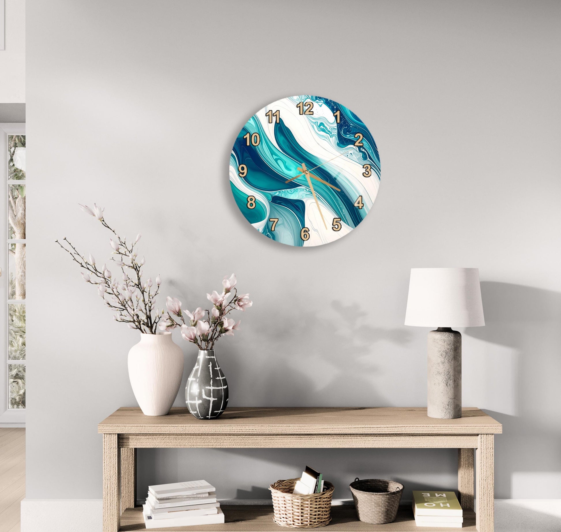 a modern living room with a wooden table, a white lamp, a vase with pink flowers, and a round wall clock with a blue and white marble design.