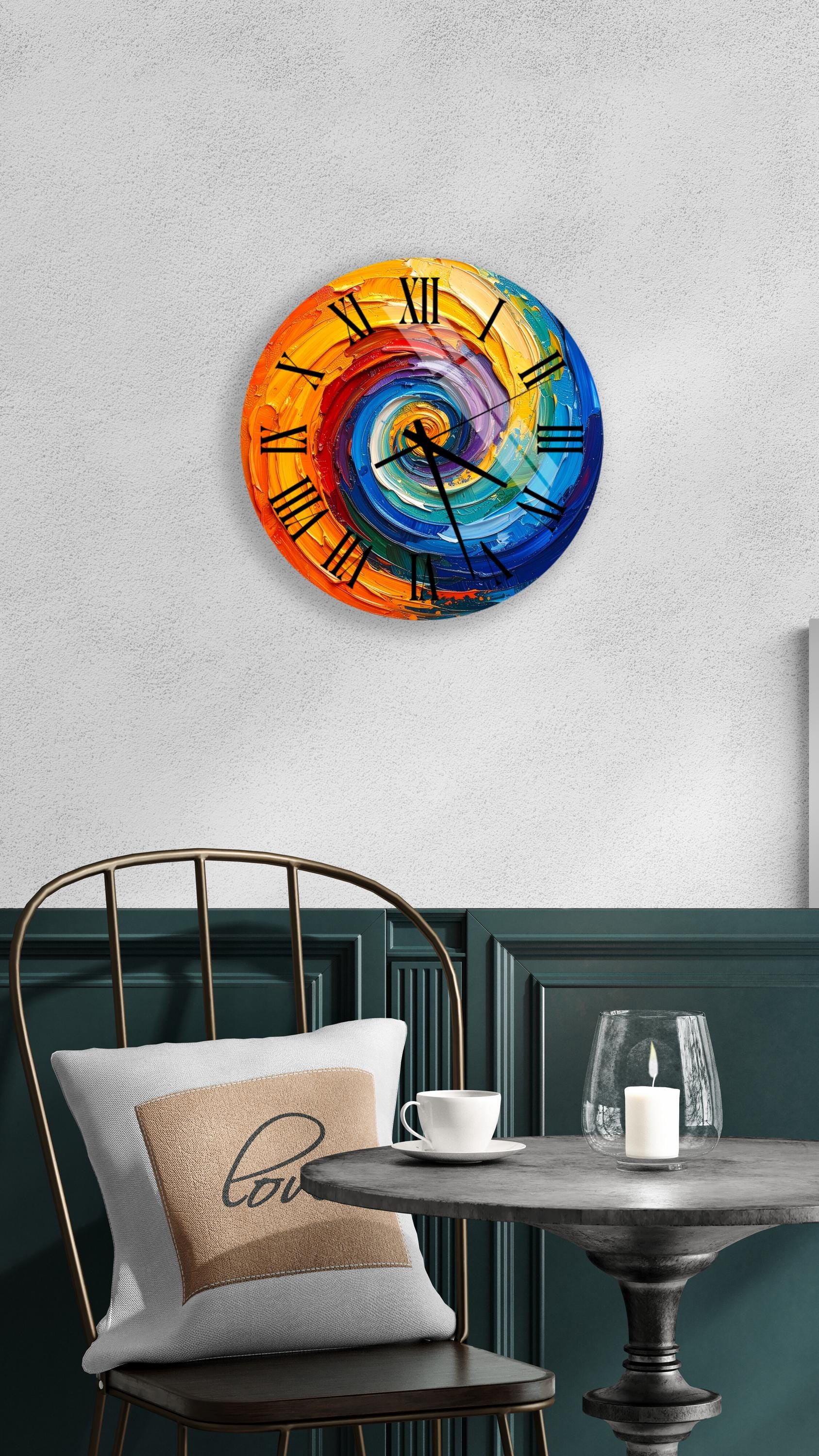 a colorful, spiral-patterned wall clock hanging on a white wall above a dining table with a white tablecloth.