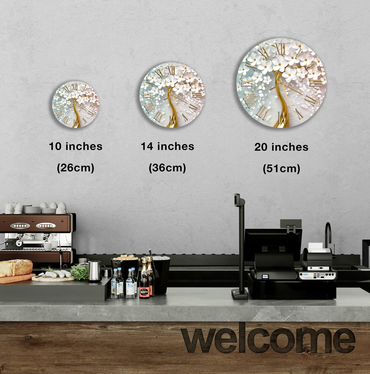 a counter with a cash register, a coffee machine, and a display of various items such as bottles and cups. There are three clock images on the wall, each representing a different size: 10 inches, 14 inches, and 20 inches. The image also includes a welcome sign on the counter.