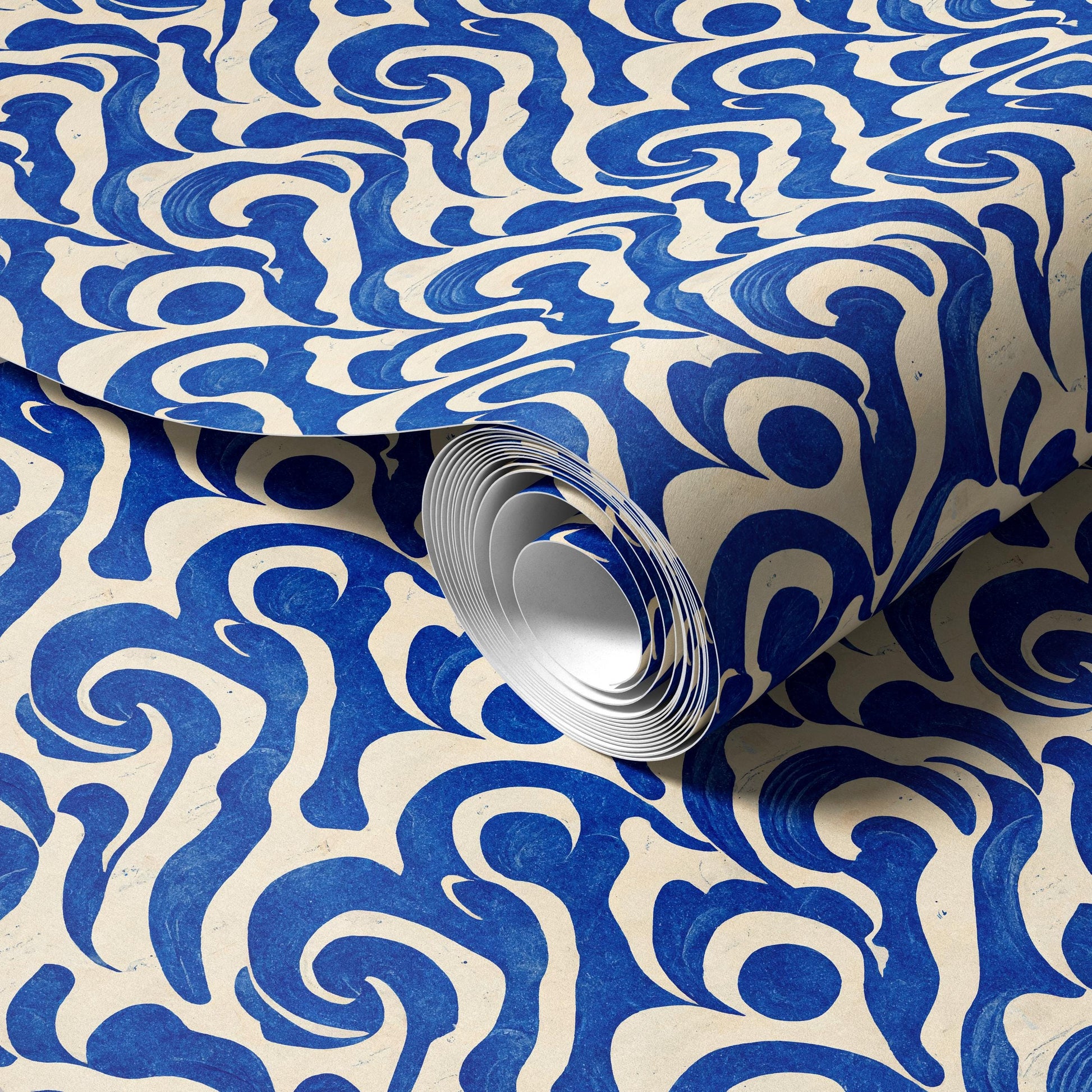 a close-up view of a roll of blue and white patterned wallpaper.