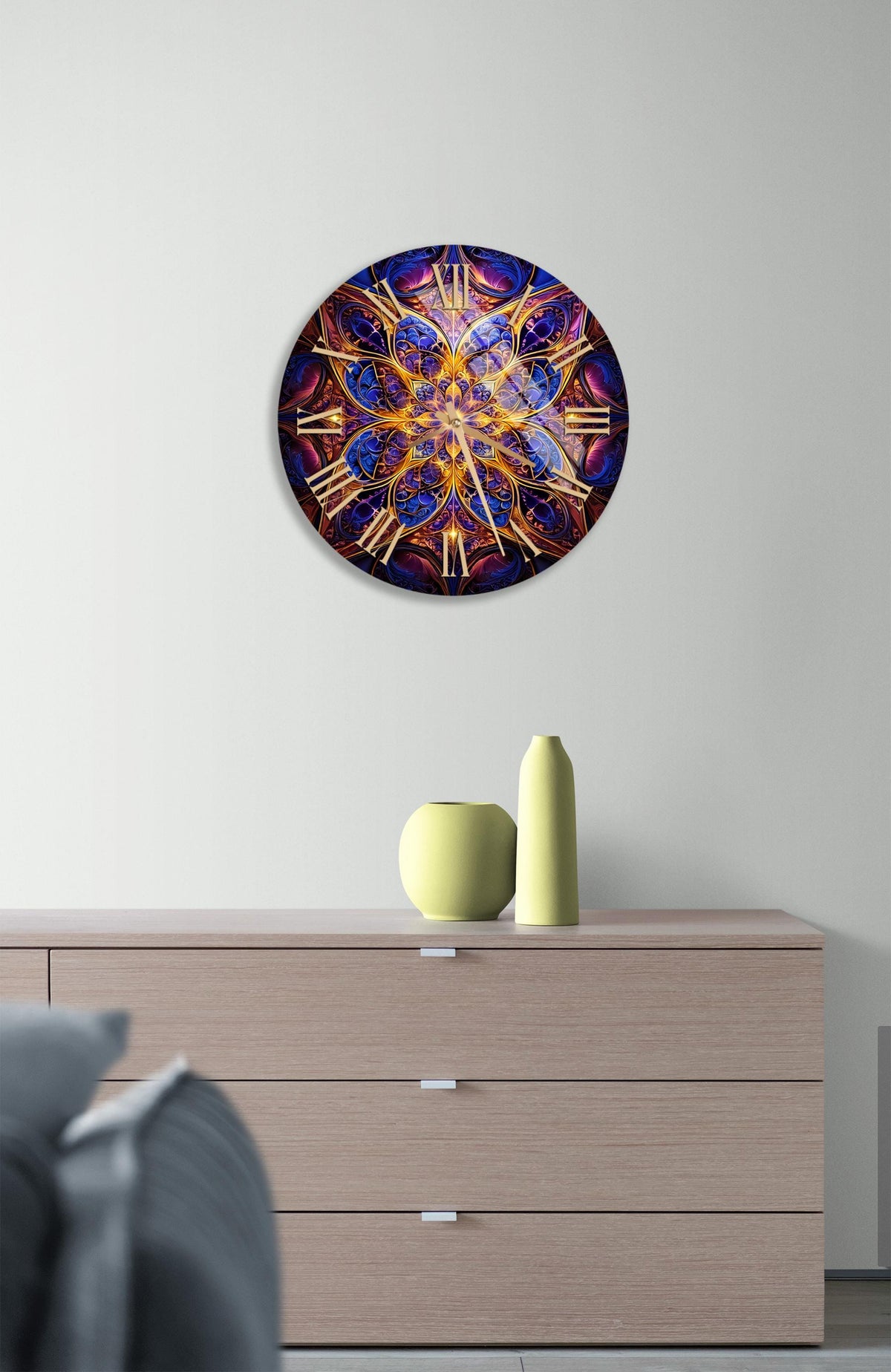a clock on a wall above a dresser