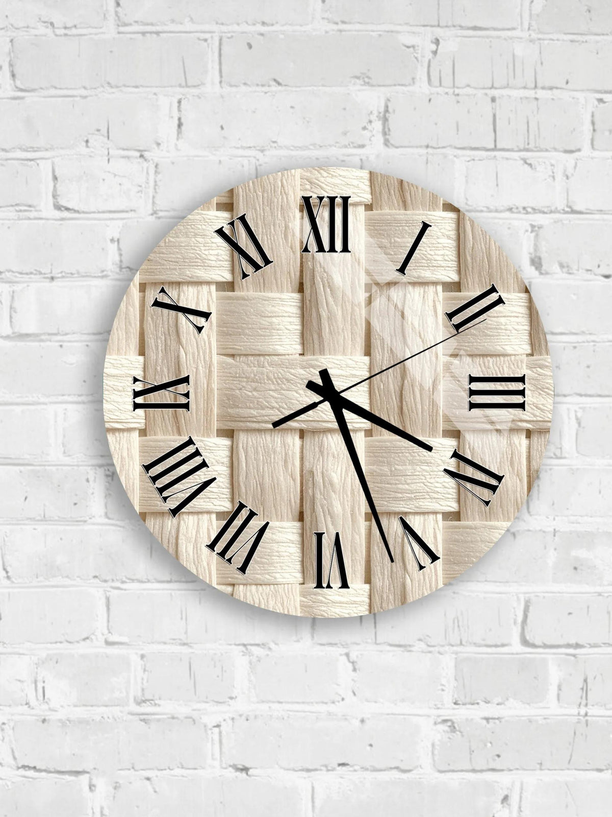 A round clock with Roman numerals on a white brick wall.