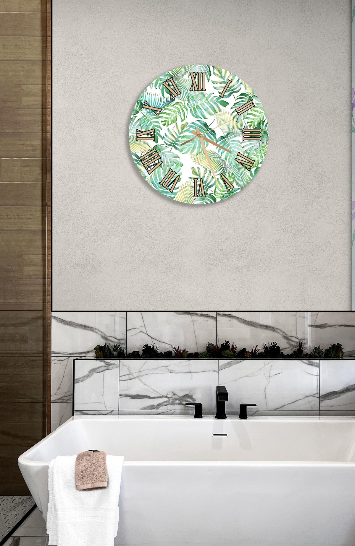 a bathroom with a white bathtub, a round wall clock with a tropical leaf pattern, and a marble tile backsplash.