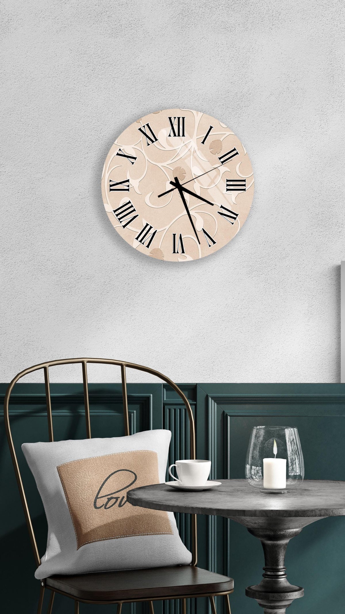 a wall clock with Roman numerals, a round table with a white cup and a candle, and a chair with a pillow.