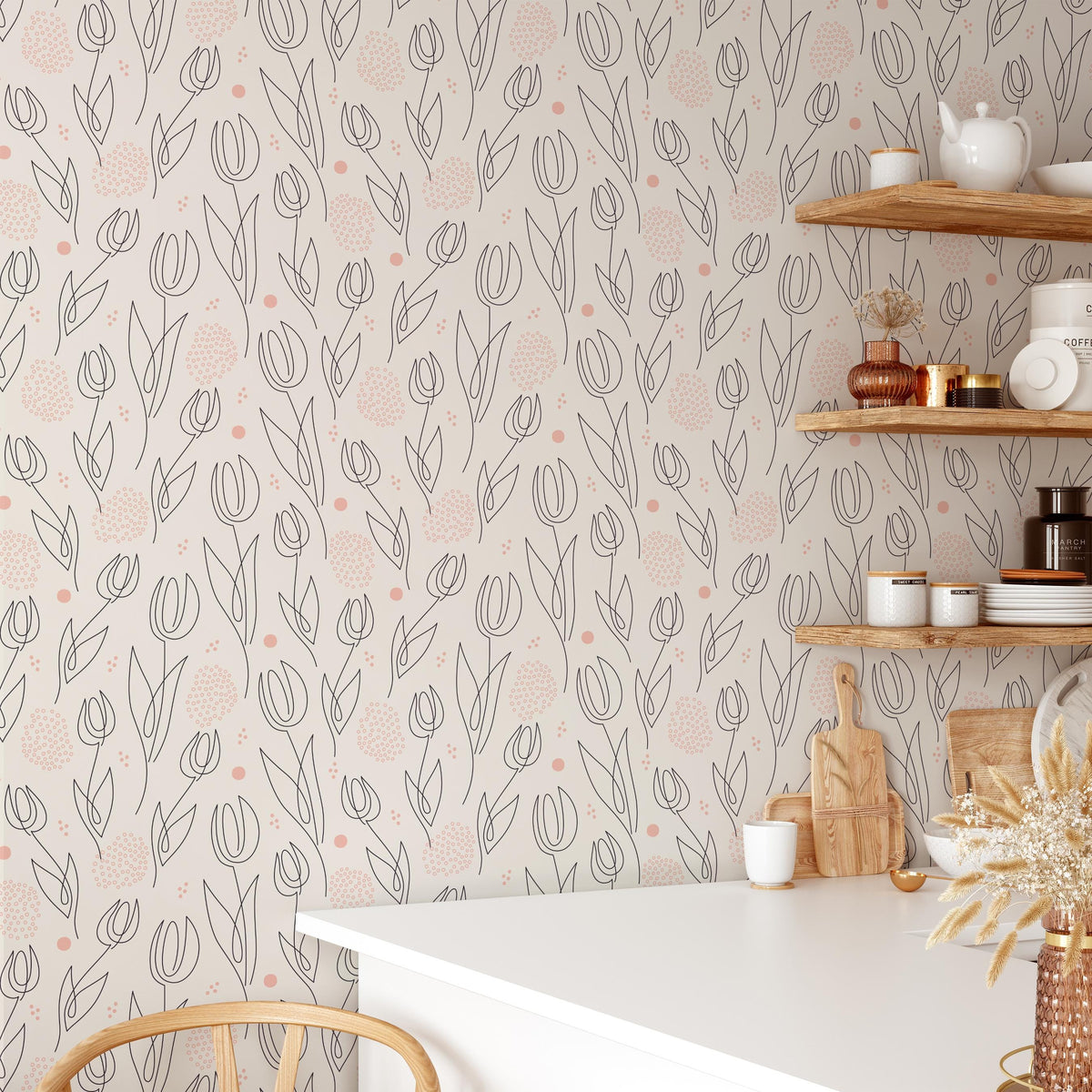 a kitchen interior with a white table, shelves displaying various kitchen items, and a patterned wallpaper with a repeating design of flowers and leaves.
